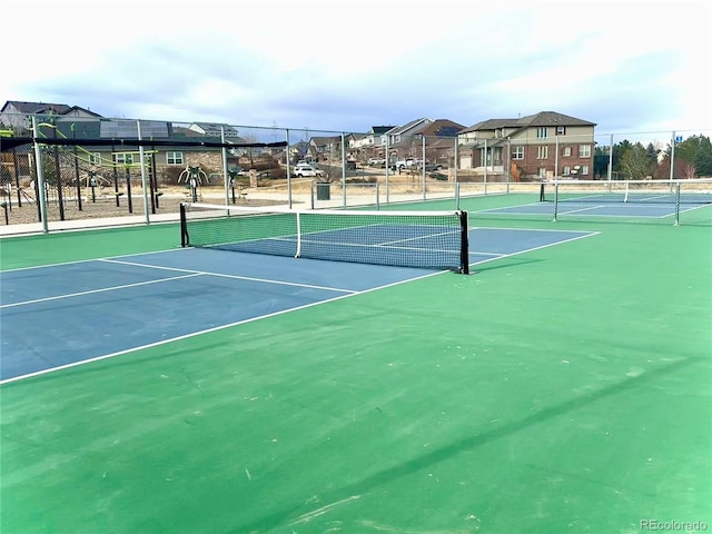 view of tennis court featuring basketball court