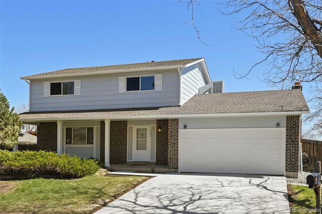 9562 W Capri Dr, Littleton, CO 80123 - traditional-style home with brick siding, an attached garage, and concrete driveway