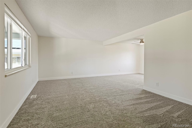 9562 W Capri Dr, Littleton, CO 80123 - spare room featuring carpet flooring, visible vents, a textured ceiling, and a ceiling fan