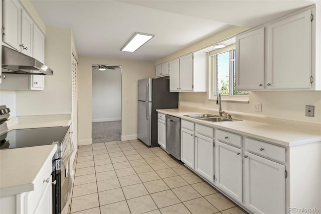 9562 W Capri Dr, Littleton, CO 80123 - kitchen featuring a ceiling fan, white cabinets, under cabinet range hood, appliances with stainless steel finishes, and a sink