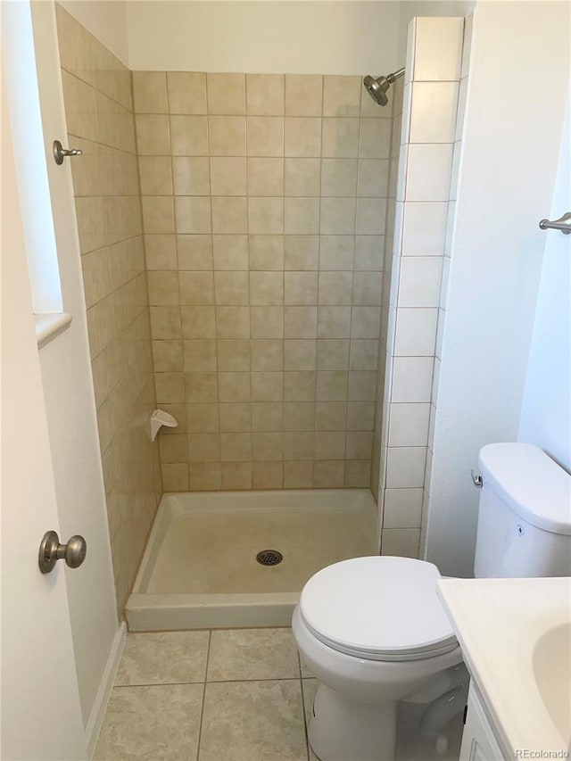 9562 W Capri Dr, Littleton, CO 80123 - bathroom featuring a shower stall, tile patterned flooring, vanity, and toilet