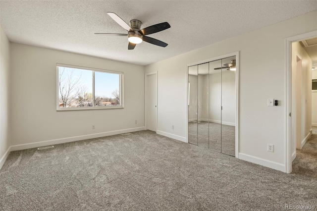 9562 W Capri Dr, Littleton, CO 80123 - unfurnished bedroom with baseboards, a closet, a textured ceiling, and carpet floors