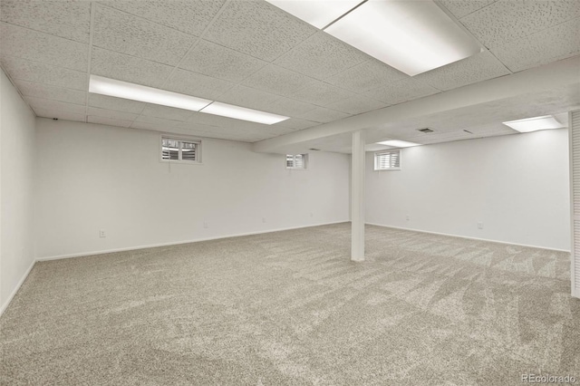 9562 W Capri Dr, Littleton, CO 80123 - below grade area with baseboards, a drop ceiling, and carpet