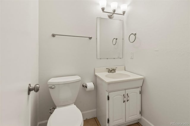 9562 W Capri Dr, Littleton, CO 80123 - half bathroom with toilet, vanity, and baseboards