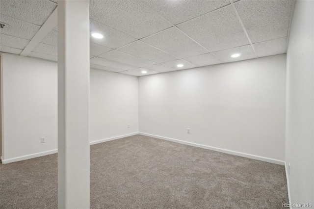 finished below grade area featuring carpet, visible vents, baseboards, and recessed lighting