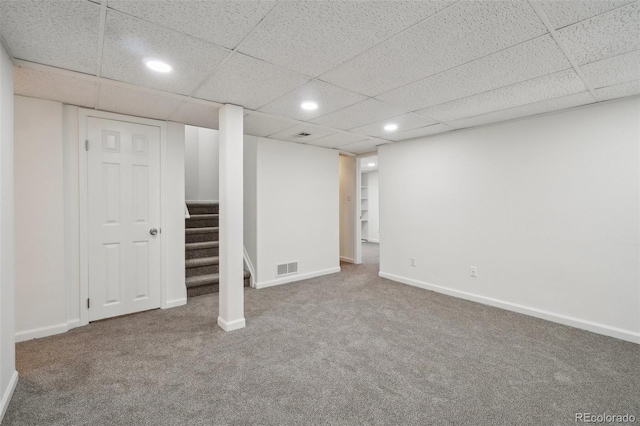 finished below grade area featuring carpet, recessed lighting, visible vents, baseboards, and stairs