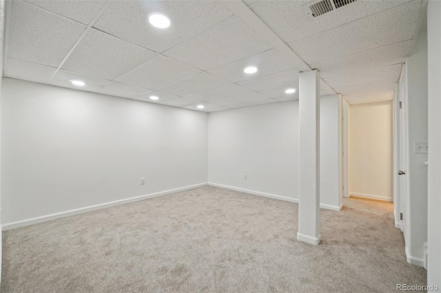 finished below grade area featuring recessed lighting, baseboards, visible vents, and carpet flooring