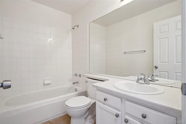 bathroom with tub / shower combination, vanity, toilet, and tile patterned floors