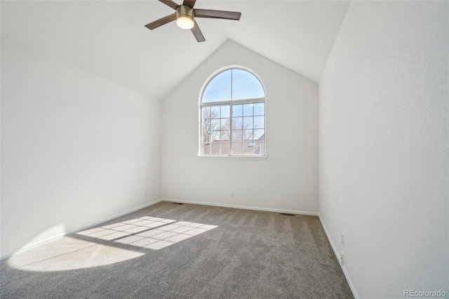 unfurnished room featuring lofted ceiling, ceiling fan, baseboards, and carpet flooring