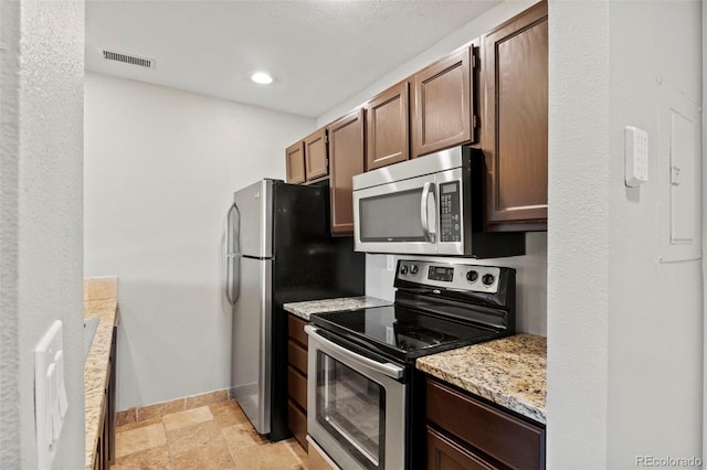 128 W Rockrimmon Blvd Unit 105, Colorado Springs, CO 80919 - kitchen featuring stainless steel appliances, light stone counters, light stone finish floors, and recessed lighting