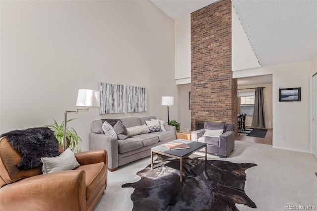 8039 E Phillips Cir, Centennial, CO 80112 - carpeted living area featuring high vaulted ceiling and a fireplace