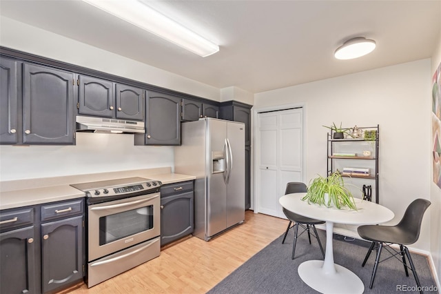 8039 E Phillips Cir, Centennial, CO 80112 - kitchen featuring appliances with stainless steel finishes, under cabinet range hood, light wood-type flooring, and light countertops