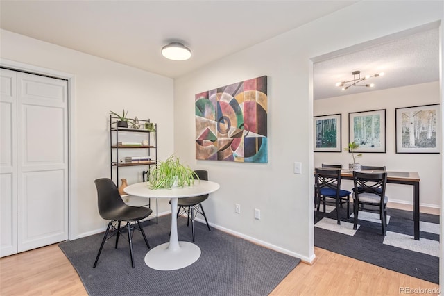 8039 E Phillips Cir, Centennial, CO 80112 - dining room with light wood-type flooring and baseboards