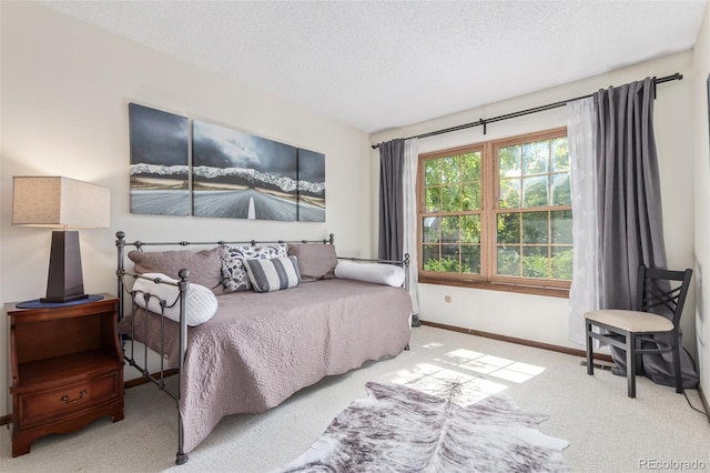 8039 E Phillips Cir, Centennial, CO 80112 - carpeted bedroom featuring a textured ceiling and baseboards