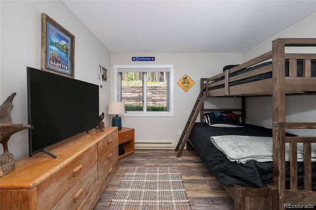 141 Forest Trl # 16, Winter Park, CO 80482 - bedroom featuring baseboard heating and dark wood finished floors
