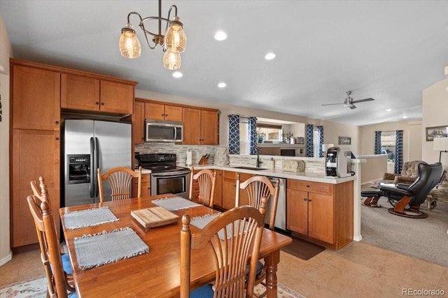 4362 Susie Vw, Colorado Springs, CO 80917 - kitchen with stainless steel appliances, a peninsula, a sink, open floor plan, and light countertops