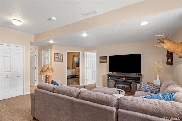 4362 Susie Vw, Colorado Springs, CO 80917 - carpeted living area featuring baseboards, recessed lighting, and a textured ceiling