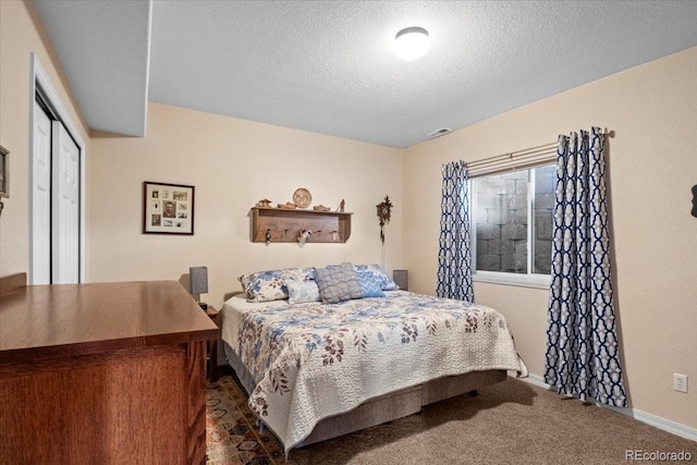 4362 Susie Vw, Colorado Springs, CO 80917 - carpeted bedroom featuring a textured ceiling, baseboards, and a closet