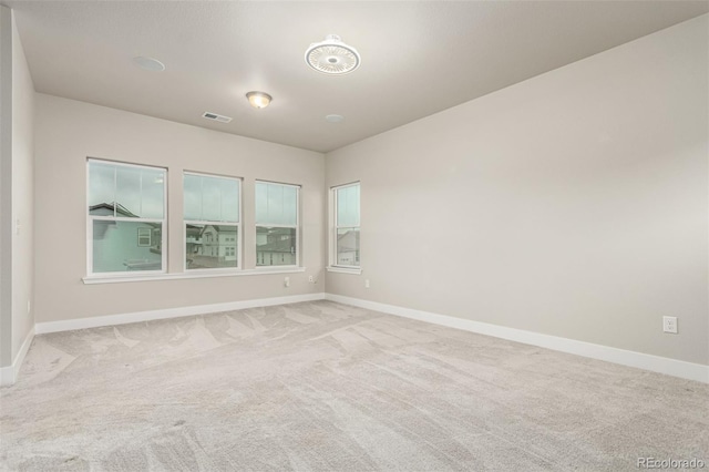21492 E 60th Ave, Aurora, CO 80019 - spare room with carpet floors, baseboards, and visible vents