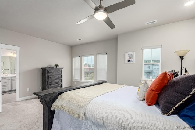 21492 E 60th Ave, Aurora, CO 80019 - bedroom featuring light colored carpet, visible vents, ceiling fan, connected bathroom, and baseboards