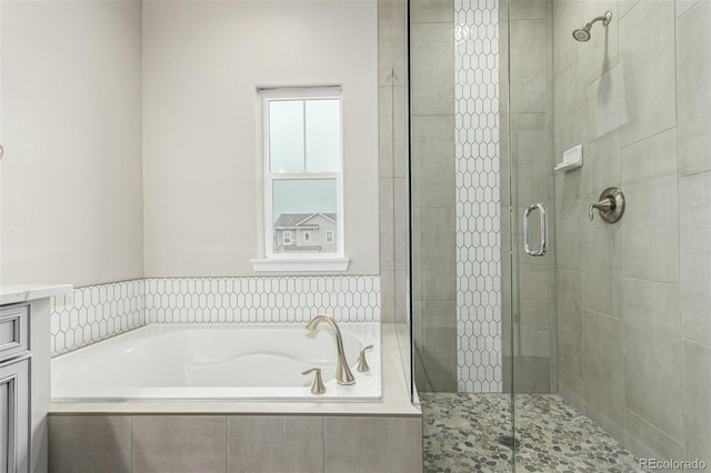 21492 E 60th Ave, Aurora, CO 80019 - bathroom featuring a bath, vanity, and a stall shower