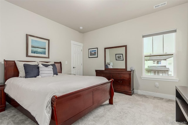 21492 E 60th Ave, Aurora, CO 80019 - bedroom featuring baseboards, visible vents, and light colored carpet