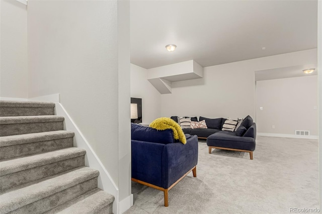 21492 E 60th Ave, Aurora, CO 80019 - living area with light colored carpet, visible vents, baseboards, and stairs