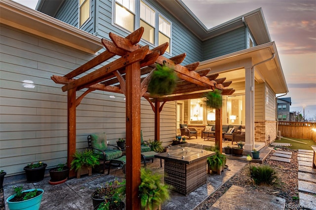 21492 E 60th Ave, Aurora, CO 80019 - patio terrace at dusk featuring outdoor lounge area, fence, and a pergola