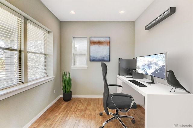 office with recessed lighting, hardwood / wood-style floors, and baseboards