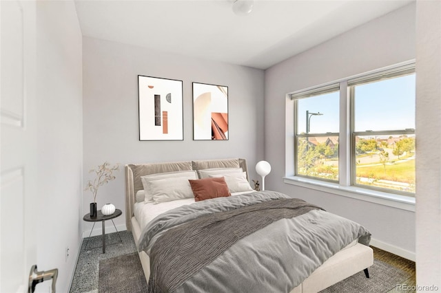 carpeted bedroom with baseboards