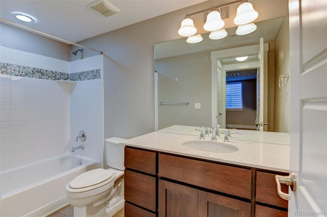 bathroom with toilet, bathtub / shower combination, visible vents, and vanity