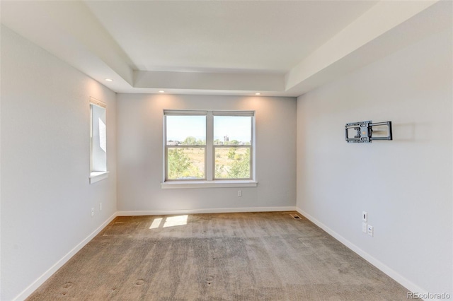 spare room with baseboards and recessed lighting