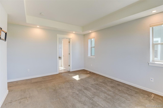 empty room with baseboards, light colored carpet, and recessed lighting