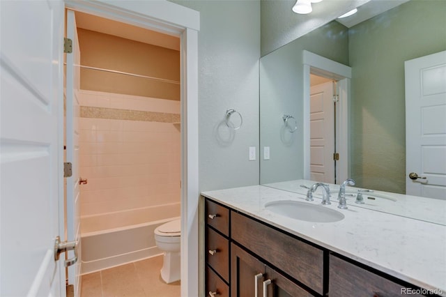 bathroom featuring toilet, tile patterned floors, bathing tub / shower combination, and vanity