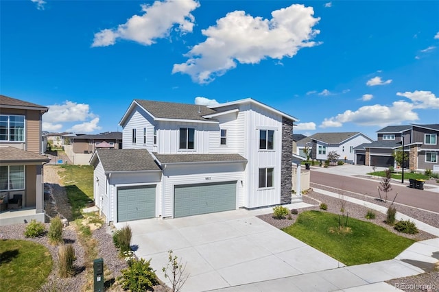 9805 Granite Park Ln, Peyton, CO 80831 - view of front facade with board and batten siding, a residential view, driveway, and an attached garage