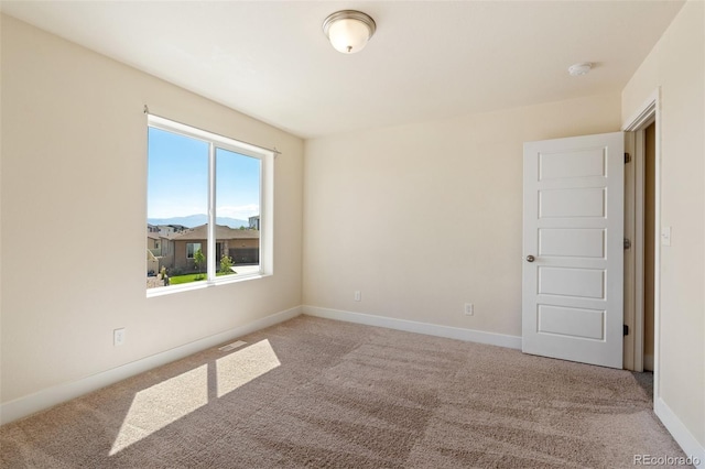 9805 Granite Park Ln, Peyton, CO 80831 - carpeted empty room featuring a smoke detector and baseboards