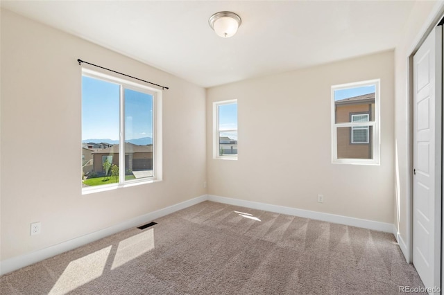 9805 Granite Park Ln, Peyton, CO 80831 - spare room featuring carpet and baseboards