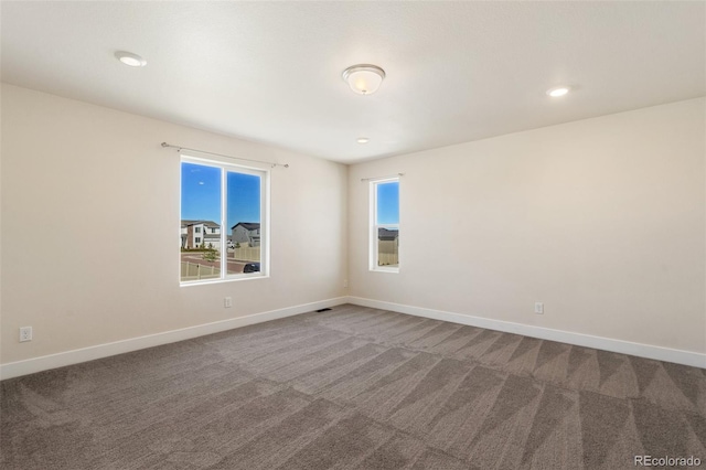 9805 Granite Park Ln, Peyton, CO 80831 - spare room with carpet floors and recessed lighting