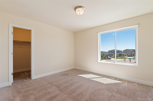 9805 Granite Park Ln, Peyton, CO 80831 - unfurnished bedroom with carpet floors, a spacious closet, and a closet