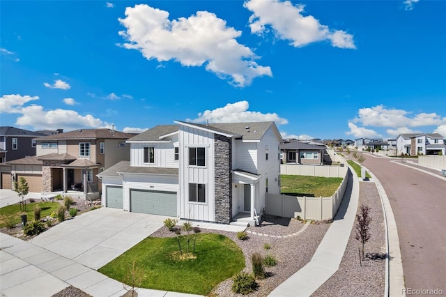 9805 Granite Park Ln, Peyton, CO 80831 - modern farmhouse style home with board and batten siding, a residential view, an attached garage, concrete driveway, and stone siding