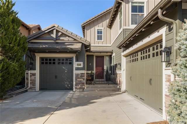 10681 Sundial Rim Rd, Highlands Ranch, CO 80126 - craftsman-style house featuring concrete driveway, board and batten siding, and stone siding