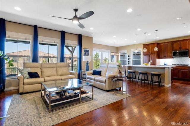 10681 Sundial Rim Rd, Highlands Ranch, CO 80126 - living room with ceiling fan, dark wood-style floors, recessed lighting, and baseboards