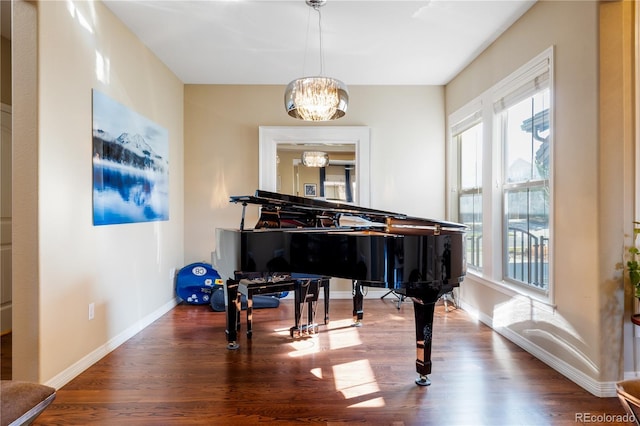 10681 Sundial Rim Rd, Highlands Ranch, CO 80126 - sitting room featuring a chandelier, healthy amount of natural light, wood finished floors, and baseboards