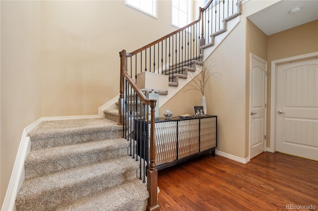 10681 Sundial Rim Rd, Highlands Ranch, CO 80126 - stairway featuring wood finished floors and baseboards