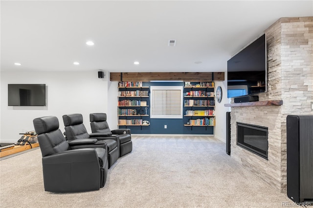10681 Sundial Rim Rd, Highlands Ranch, CO 80126 - living room featuring carpet floors, recessed lighting, a stone fireplace, and baseboards