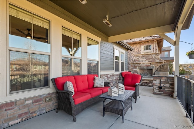 10681 Sundial Rim Rd, Highlands Ranch, CO 80126 - view of patio / terrace with an outdoor living space with a fireplace