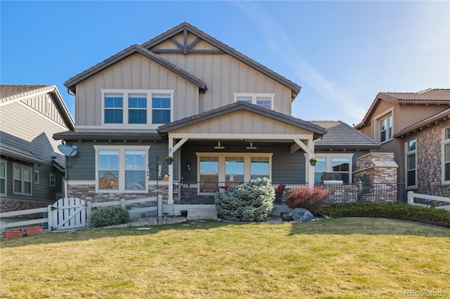 10681 Sundial Rim Rd, Highlands Ranch, CO 80126 - craftsman-style home featuring board and batten siding, covered porch, a gate, and stone siding