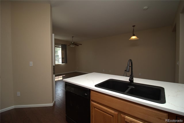 kitchen featuring pendant lighting, sink, ceiling fan, dark hardwood / wood-style floors, and black dishwasher