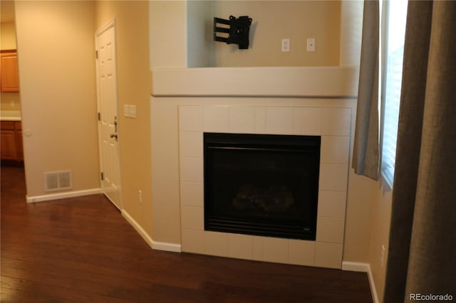 interior details with a fireplace and hardwood / wood-style floors