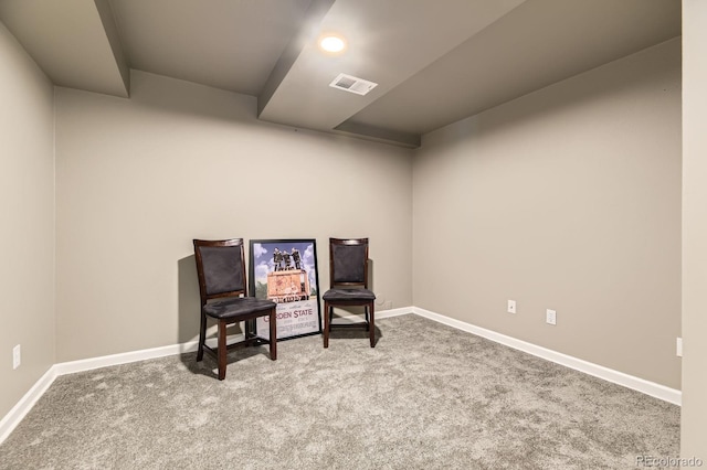 sitting room with carpet and baseboards